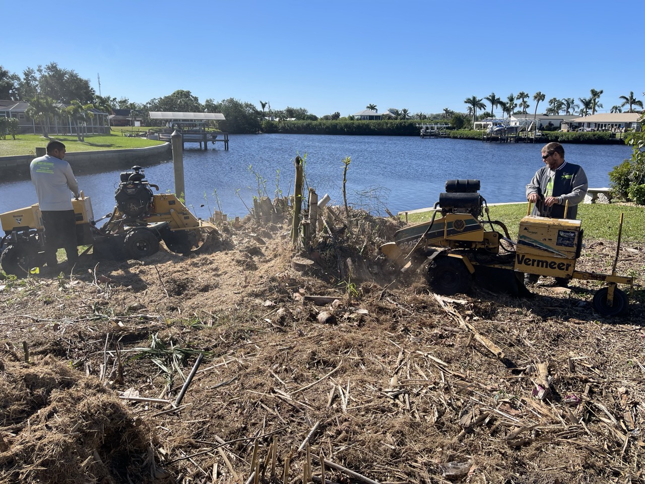 Stump grining near retention pond in Lehigh